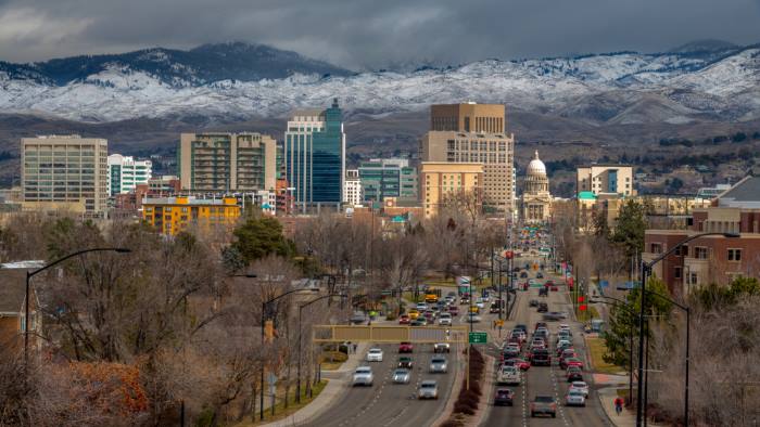 Boise Idaho, a city in the Rocky Mountain States, with mountains in the background.