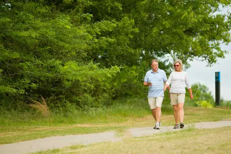 couple walking on the trail at Shelby Farms Park near Memphis Tennessee