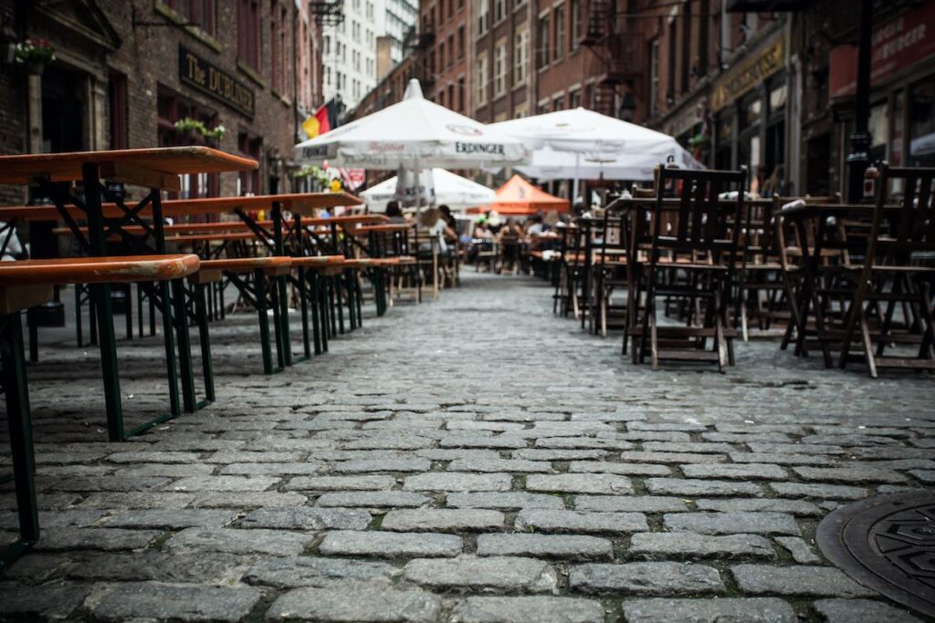 View of outdoor dining area on historic Stone Street in the Financial District in lower Manhattan