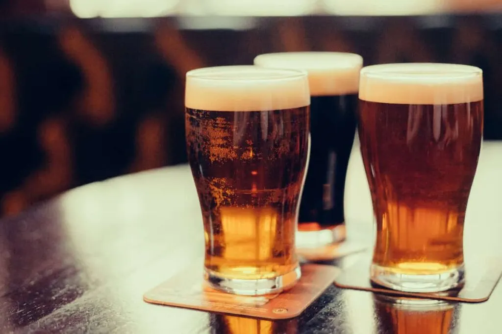 three different beers on the table