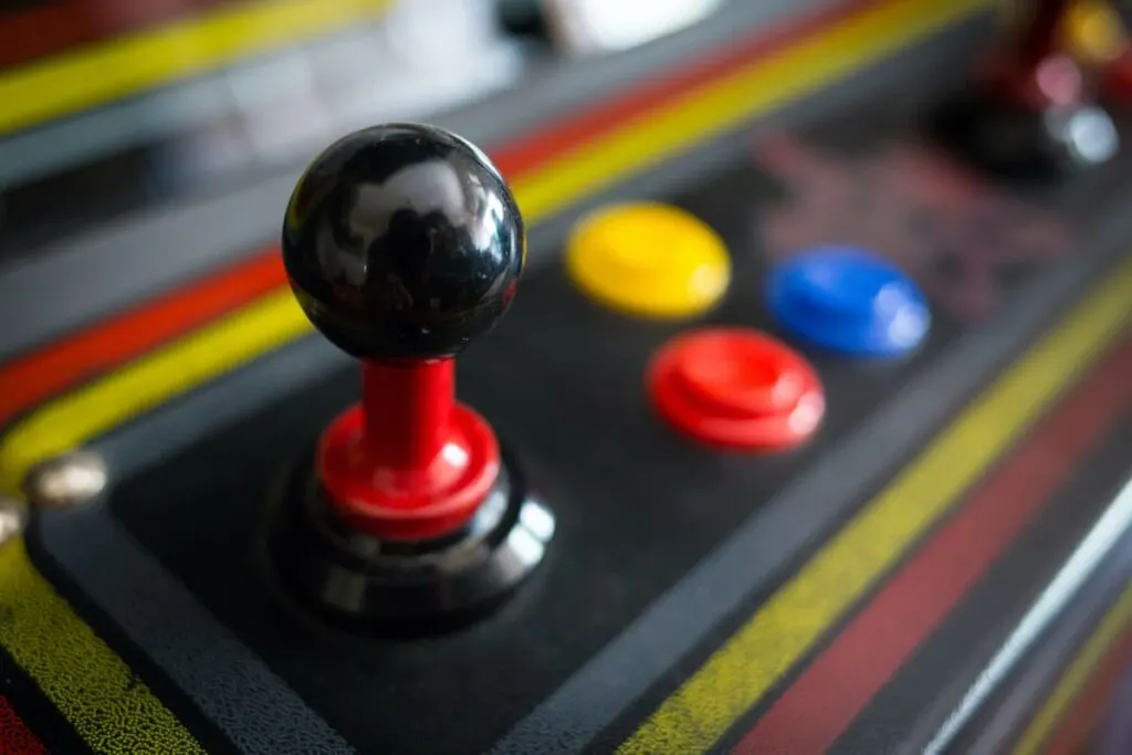 Closeup of an arcade game joystick and buttons. Games are on attraction at the world's largest McDonald's.