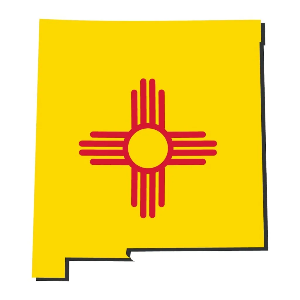 A graphic of the state of New Mexico with the yellow color and red zia symbol of the state flag.
