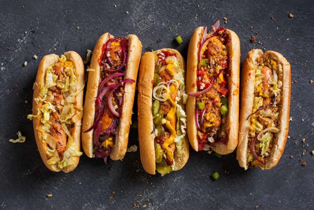 Overhead view of several styles of hot dogs.