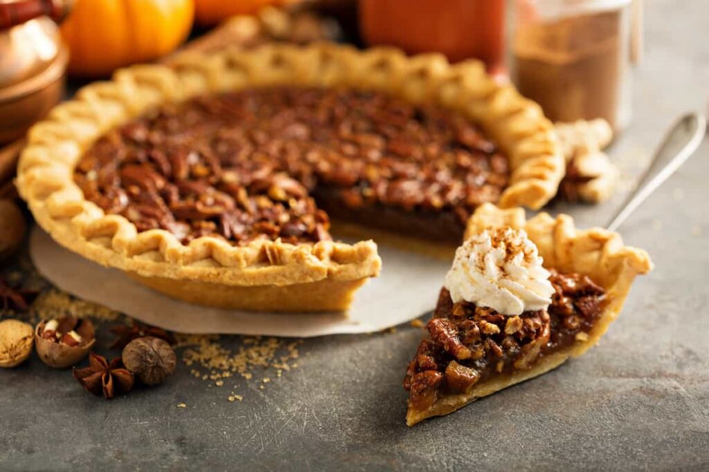 A slice of Southern pecan pie. American foods.