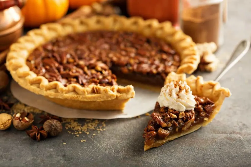 A slice of Southern pecan pie. American foods.